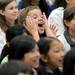 Logan Elementary School third-grader Joseph Brown shows his excitement as teachers take the stage in a surprise flash mob dance performance during a year-end assembly on Friday morning. Melanie Maxwell I AnnArbor.com